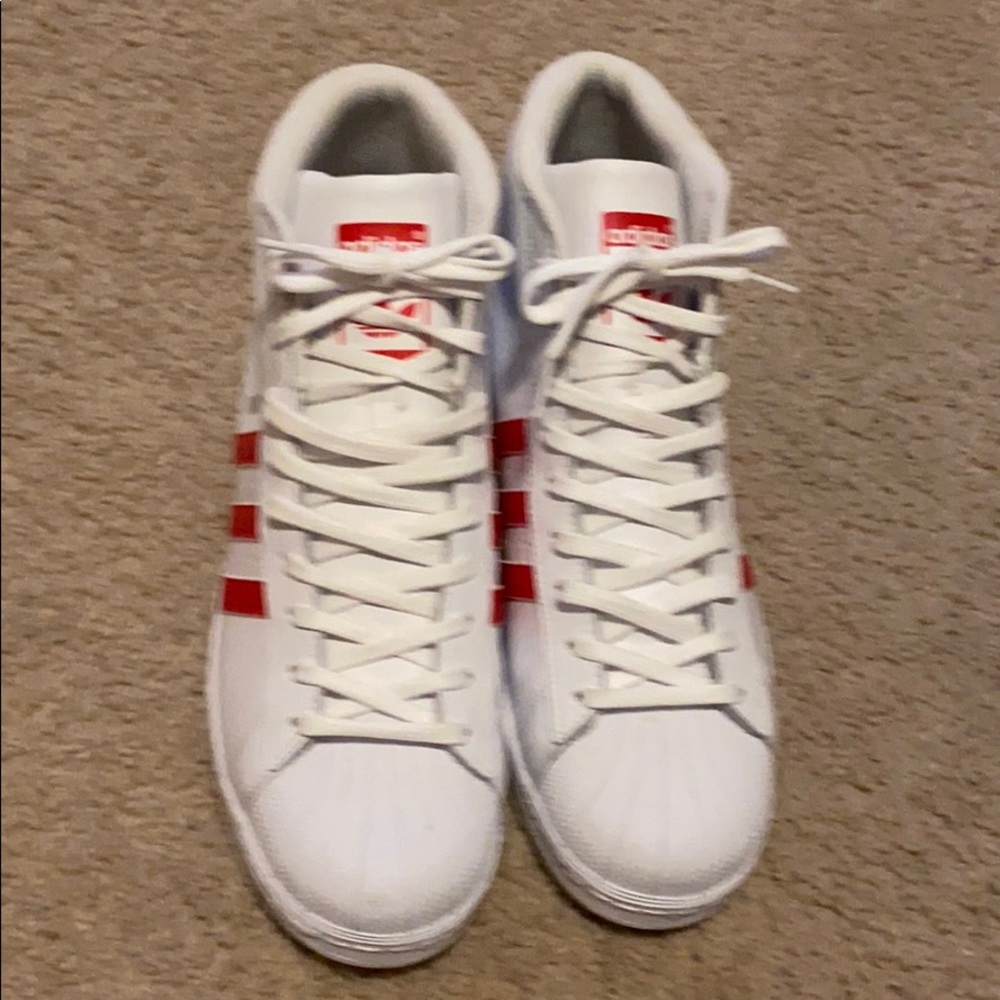Red and white high top Adidas